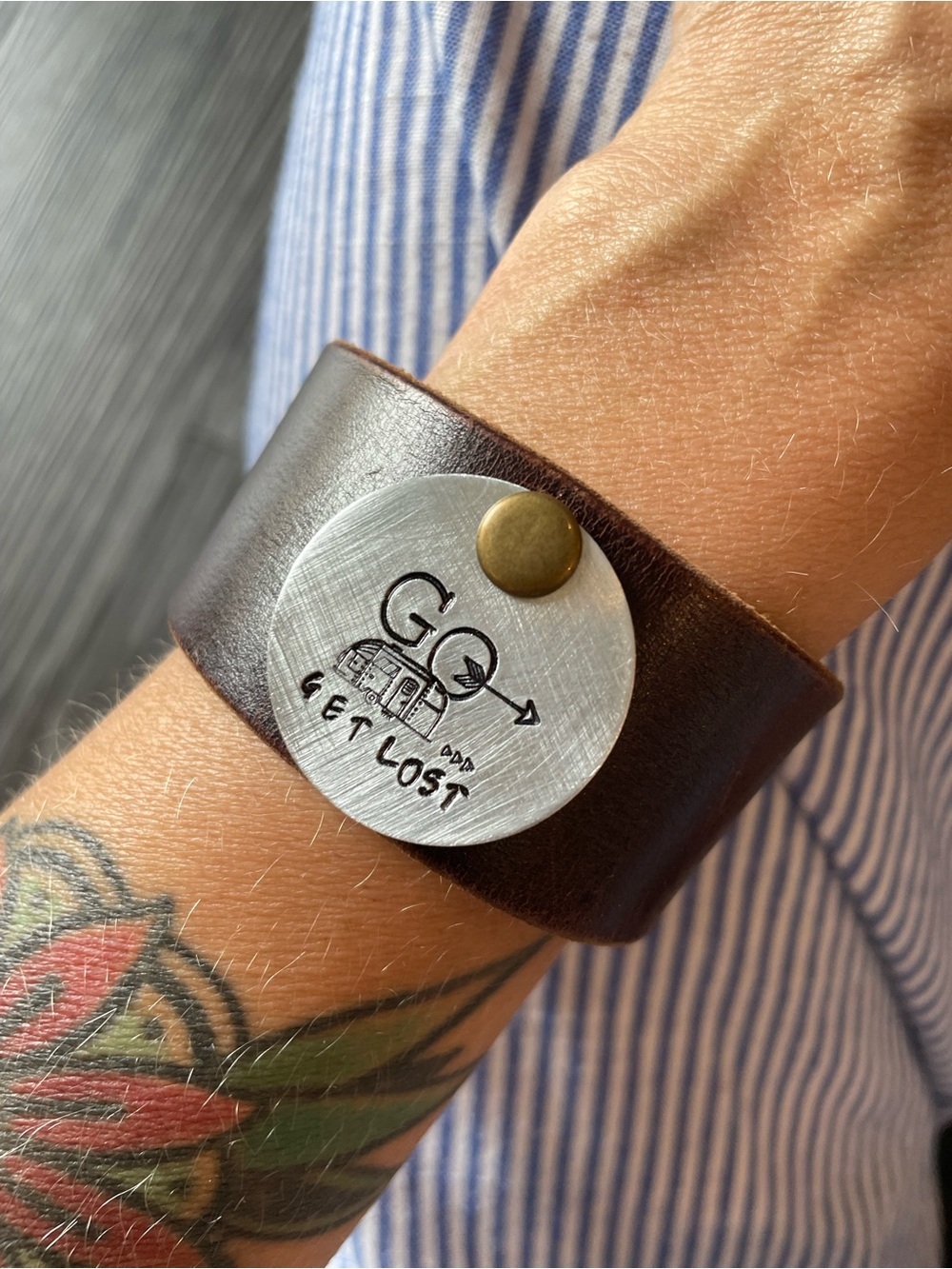 Brown Leather Cuff Bracelet with 'Get Lost' Medallion